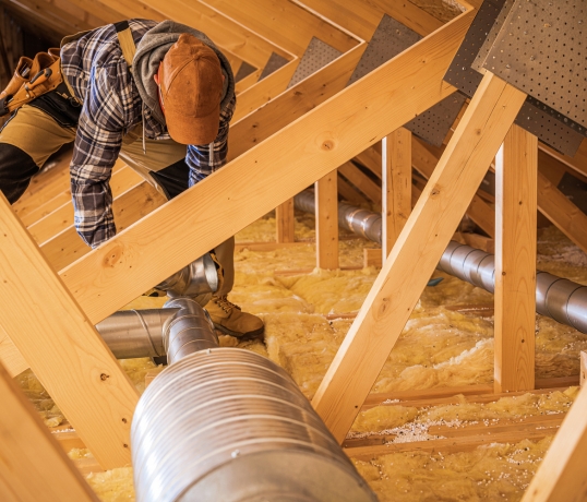technician installing duct work