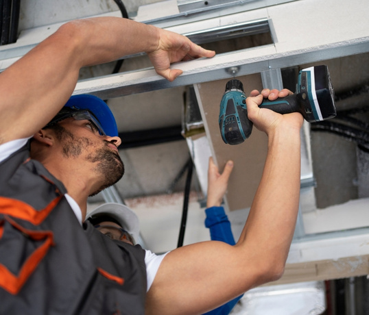 person using drilling machine