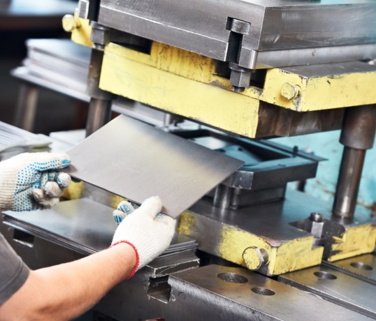 technician cutting sheet metal